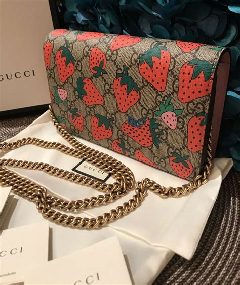 gucci strawberry chain wallet|Gucci interlocking wallet on chain.